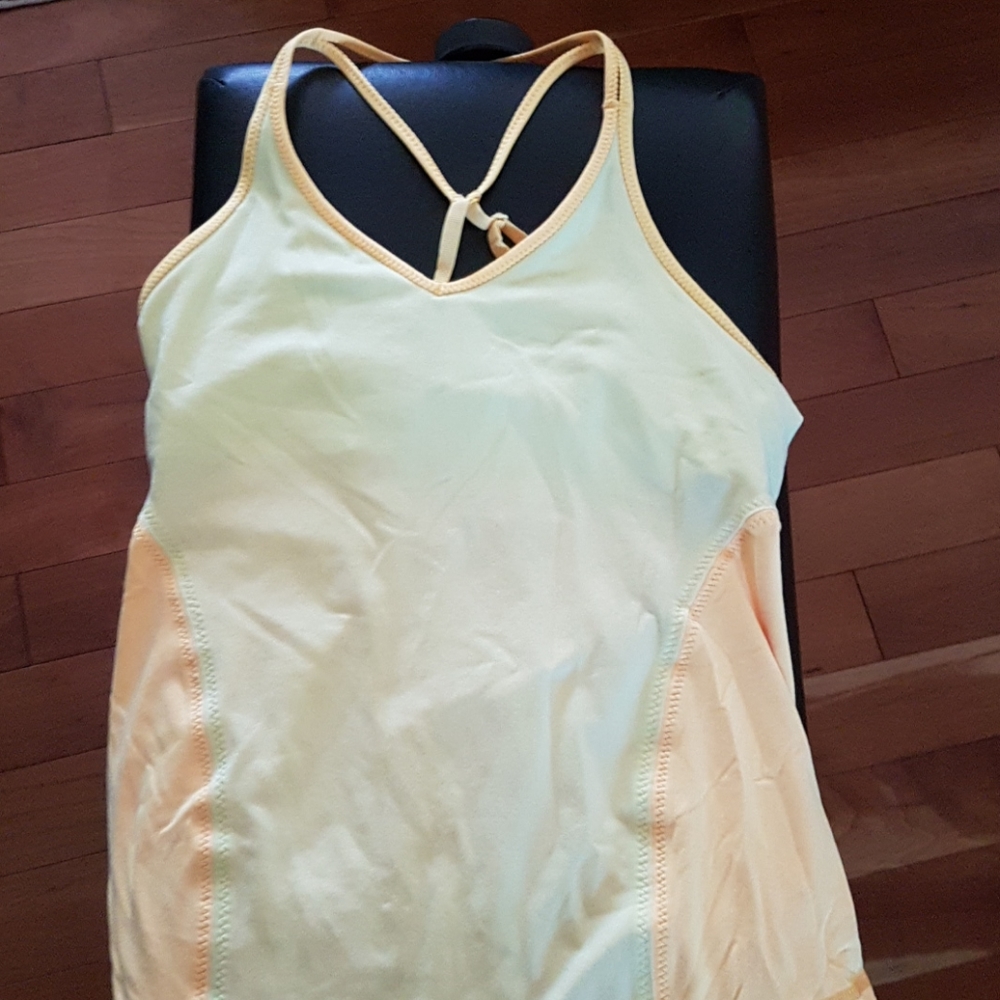 Yellow lululemon top.